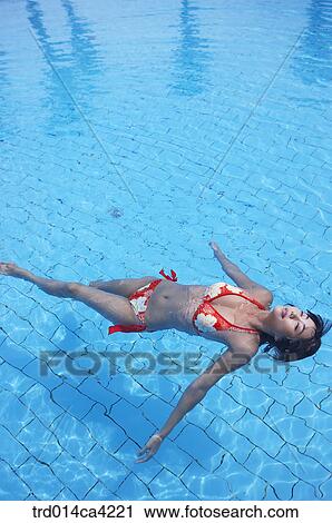 Stock Image - swimmingplace, swimmingpool, water, body, wholebody, bikini, swimwear. Fotosearch