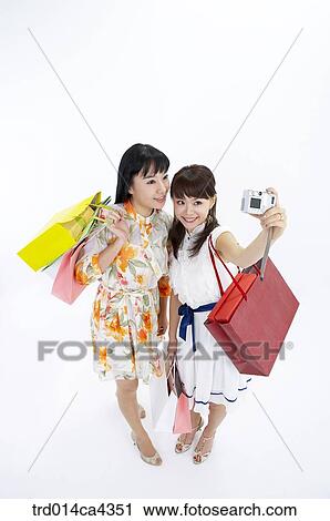 Stock Image - body, wholebody, smile, laugh, laughter, shopping, shoppingbag. Fotosearch