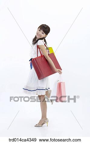Stock Photo - body, wholebody, smile, laugh, laughter, shopping, shoppingbag. Fotosearch