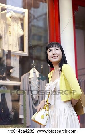 Stock Image - showcase, shopwindow, showwindow, displaywindow, shop, store, smile. Fotosearch