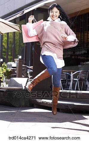 Stock Image - smile, laugh, laughter, cafe, openaircafe, opencafe, boots. Fotosearch