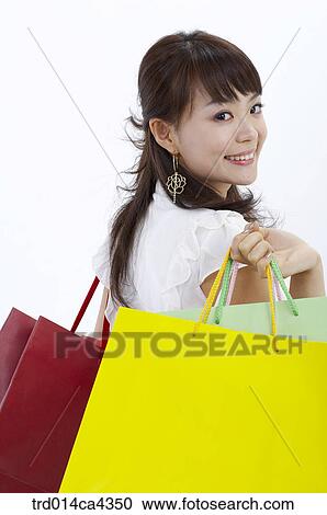 smile, laugh, laughter, shopping, shoppingbag, paperbag, yellow View Large Photo Image Stock Image - smile, laugh, laughter, shopping, shoppingbag, paperbag, yellow. Fotosearch