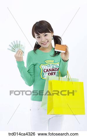 Stock Photograph - smile, laugh, laughter, shopping, shoppingbag, paperbag, yellow. Fotosearch