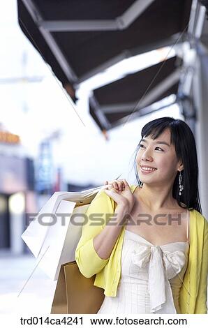 smile, laugh, laughter, shoppingbag, yellow, shopping, consumption View Large Photo Image Stock Image - smile, laugh, laughter, shoppingbag, yellow, shopping, consumption. Fotosearch