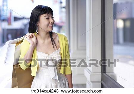 smile, laugh, laughter, shoppingbag, yellow, shopping, consumption View Large Photo Image Stock Image - smile, laugh, laughter, shoppingbag, yellow, shopping, consumption. Fotosearch