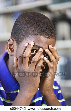 boy-peeking-through-fingers-covering-stock-photo__c0044742.jpg