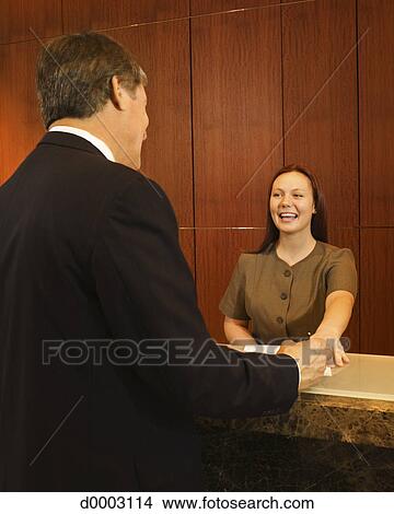 Clerk At Hotel Front Desk Picture D0003114 Fotosearch