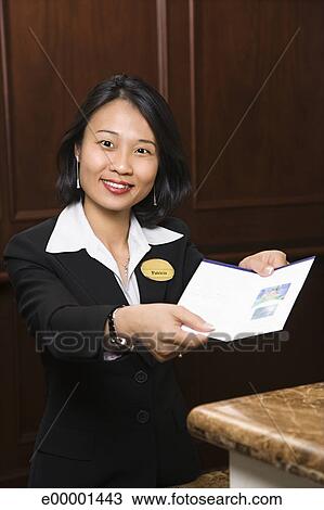 Woman Hotel Desk Clerk Stock Image E00001443 Fotosearch
