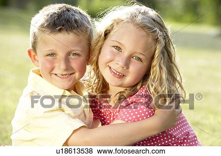 2 Children hugging outdoors View Large Photo Image Stock Photo - 2 Children hugging outdoors. Fotosearch