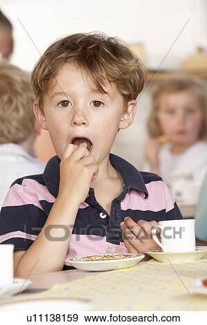 Stock Photo - Adult Playing with Two Children at Montessori/Pre-School. Fotosearch