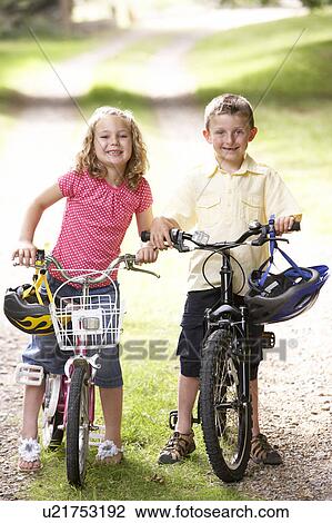 Children riding bikes in countryside View Large Photo Image Stock Image - Children riding bikes in countryside. Fotosearch