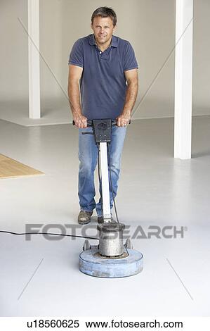 Stock Photography - Cleaner polishing office floor. Fotosearch