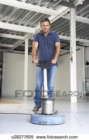 Stock Photography - Cleaner polishing office floor. Fotosearch