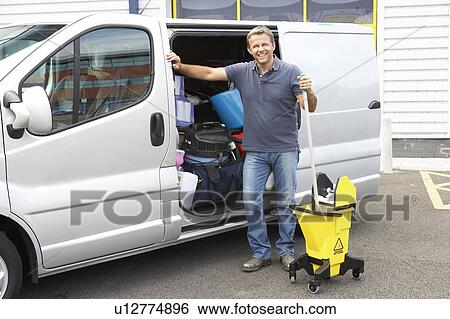 Cleaner standing next to van View Large Photo Image Stock Photograph - Cleaner standing next to van. Fotosearch