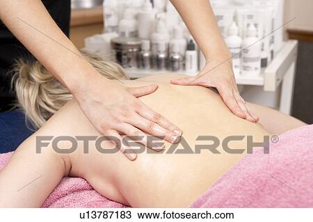 Close Up of female masseuse with client View Large Photo Image Stock Image - Close Up of female masseuse with client. Fotosearch