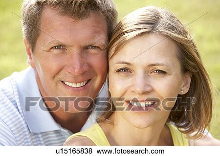Close up of middle aged couple outdoors View Large Photo Image Stock Photo - Close up of middle aged couple outdoors. Fotosearch