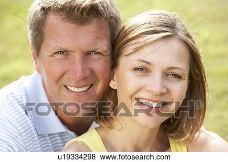 Close up of middle aged couple outdoors View Large Photo Image Stock Photo - Close up of middle aged couple outdoors. Fotosearch