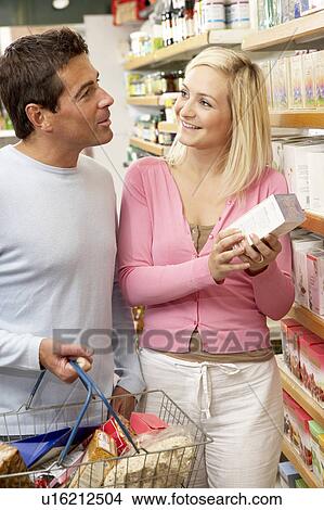 Picture - Couple shopping in health food shop. Fotosearch