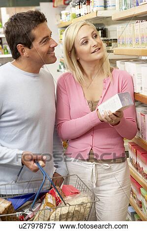 Stock Photo - Couple shopping in health food shop. Fotosearch