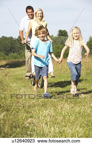 Family having fun in countryside View Large Photo Image Stock Image - Family having fun in countryside. Fotosearch