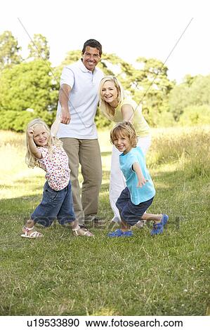 Family having fun in countryside View Large Photo Image Stock Image - Family having fun in countryside. Fotosearch