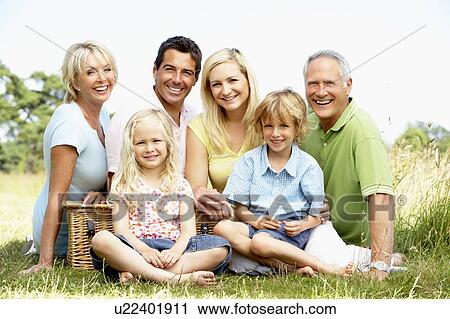 Family having picnic in countryside View Large Photo Image Stock Image - Family having picnic in countryside. Fotosearch