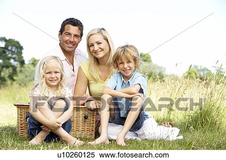 Stock Photography - Family having picnic in countryside. Fotosearch