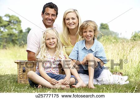 Stock Photography - Family having picnic in countryside. Fotosearch