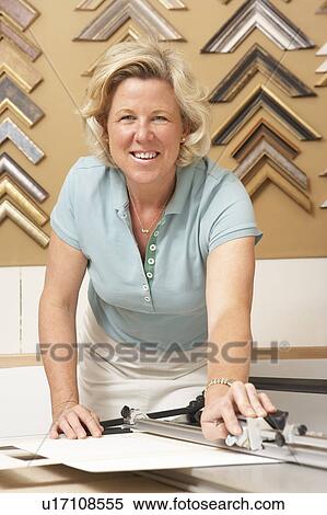 Female picture framer at work View Large Photo Image Stock Photography - Female picture framer at work. Fotosearch