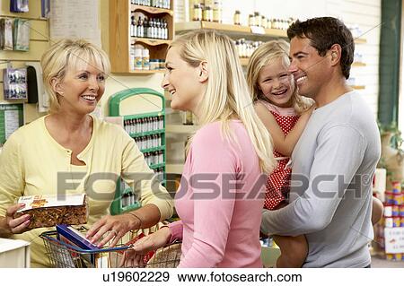 Female sales assistant in health food store View Large Photo Image Stock Photo - Female sales assistant in health food store. Fotosearch
