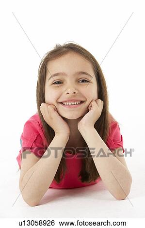 Stock Photograph - Girl Laying on Stomach. Fotosearch