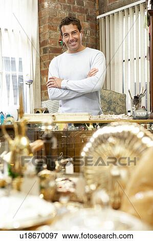 Male antique shop proprietor View Large Photo Image Stock Photo - Male antique shop proprietor. Fotosearch