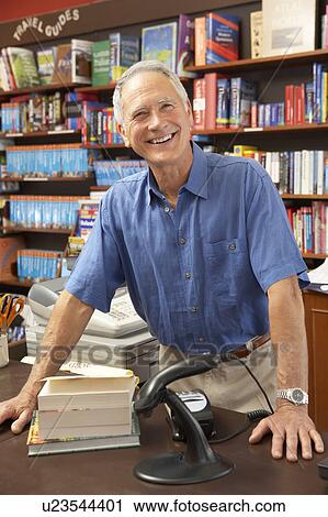 Stock Image - Male bookshop proprietor. Fotosearch