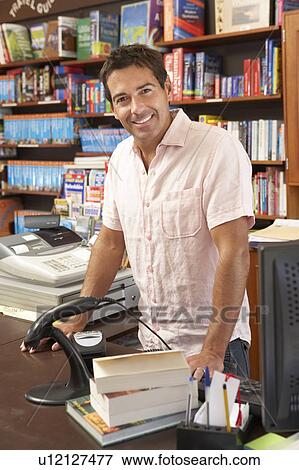 Male bookshop proprietor View Large Photo Image Stock Photo - Male bookshop proprietor. Fotosearch