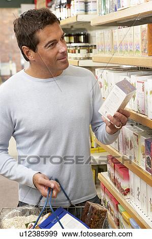 Male customer buying herbal tea View Large Photo Image Stock Photo - Male customer buying herbal tea. Fotosearch