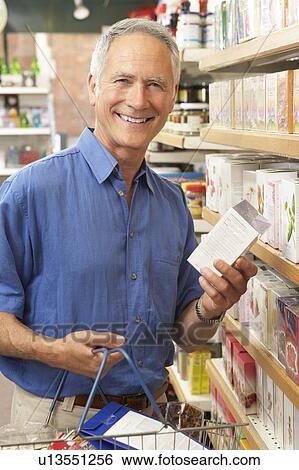 Stock Photograph - Male customer buying herbal tea. Fotosearch