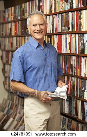 Male customer in bookshop View Large Photo Image Stock Image - Male customer in bookshop . Fotosearch
