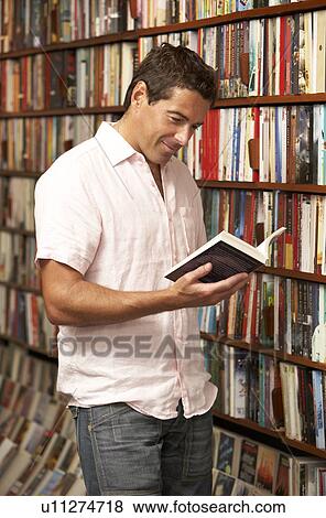 Stock Photo - Male customer in bookshop. Fotosearch