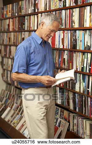 Male customer in bookshop View Large Photo Image Stock Photograph - Male customer in bookshop . Fotosearch