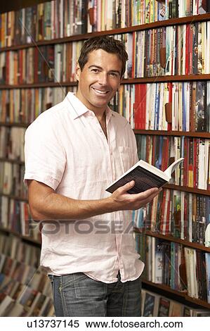 Male customer in bookshop View Large Photo Image Stock Photography - Male customer in bookshop. Fotosearch