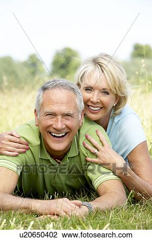 Mature couple having fun in countryside View Large Photo Image Stock Image - Mature couple having fun in countryside. Fotosearch