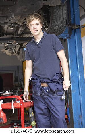 Stock Photograph - Mechanic working on car. Fotosearch