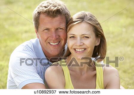 Middle aged couple having fun in countryside View Large Photo Image Stock Photo - Middle aged couple having fun in countryside. Fotosearch