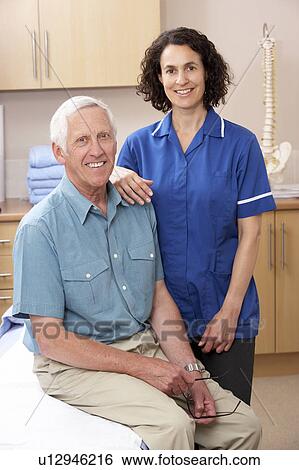 Portrait of male and female osteopath View Large Photo Image Stock Photograph - Portrait of male and female osteopath. Fotosearch