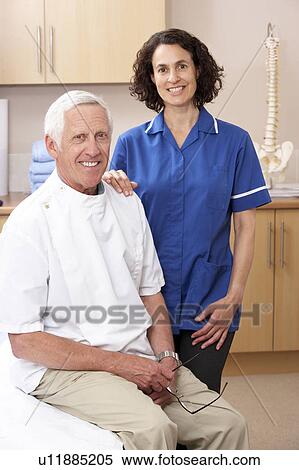 Portrait of male and female osteopath View Large Photo Image Stock Photography - Portrait of male and female osteopath. Fotosearch