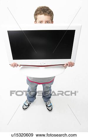 Portrait of Smiling Teenage Boy Holding Television View Large Photo Image Stock Photo - Portrait of Smiling Teenage Boy Holding Television. Fotosearch