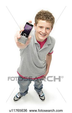Portrait of Smiling Teenage Boy Holding Mobile Phone View Large Photo Image Stock Photograph - Portrait of Smiling Teenage Boy Holding Mobile Phone. Fotosearch