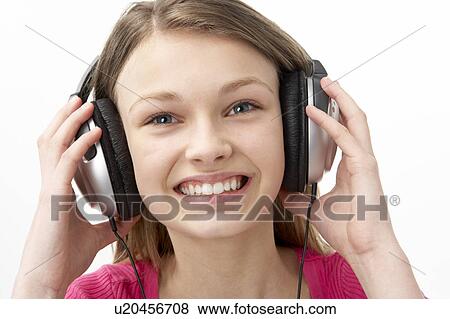 Portrait of Smiling Teenage Girl Listening to Music View Large Photo Image Stock Photo - Portrait of Smiling Teenage Girl Listening to Music. Fotosearch
