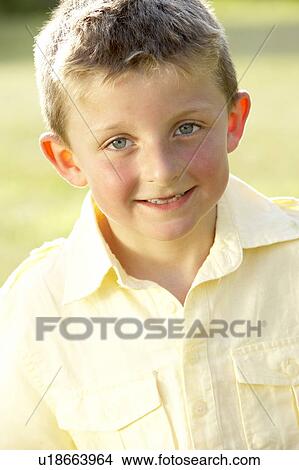 Portrait of young boy in countryside View Large Photo Image Picture - Portrait of young boy in countryside. Fotosearch