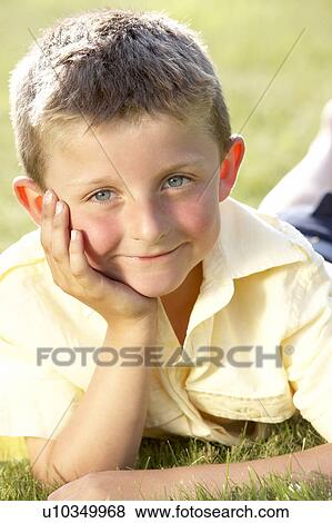 Stock Photo - Portrait of young boy in countryside. Fotosearch
